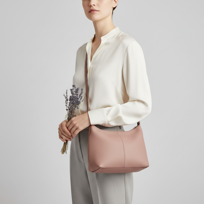 Versatile Sling luxury sling bag in Dusty Rose – female model wearing bag